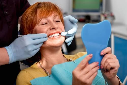 woman getting dental implants in coburg